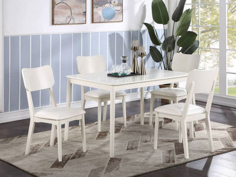 simple white table and four cushioned chairs