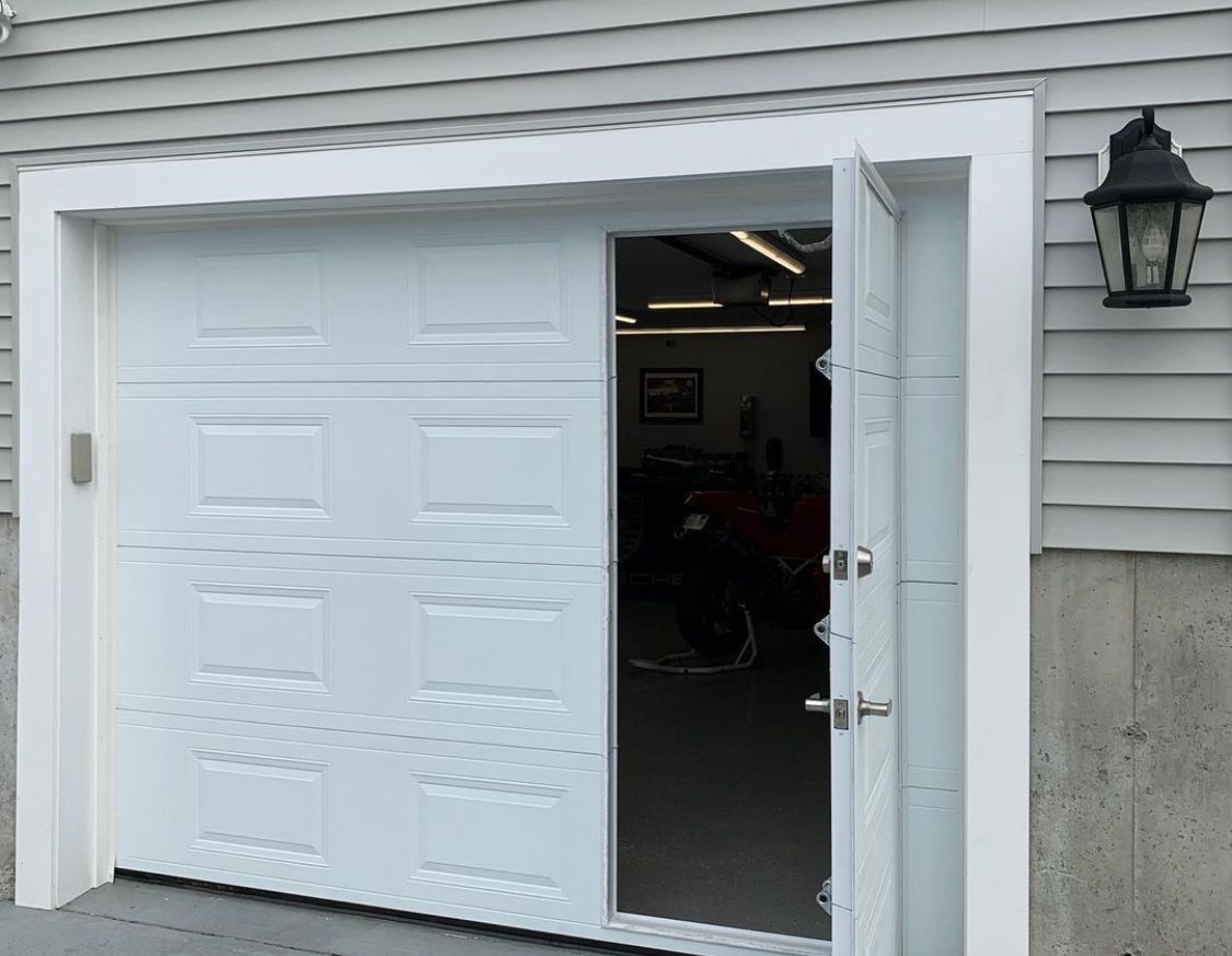 A white garage door is open 