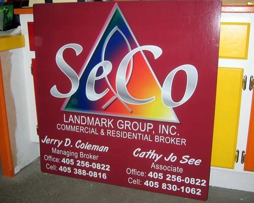 A sign for landmark group inc. commercial and residential broker