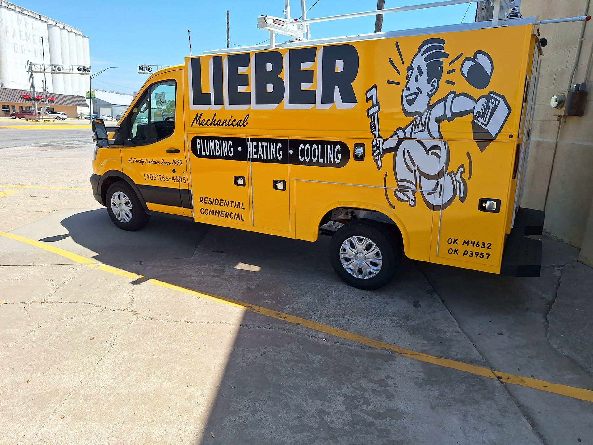 A yellow lieber van is parked in a parking lot