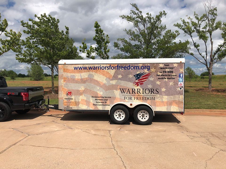 A trailer with warriors for freedom written on it