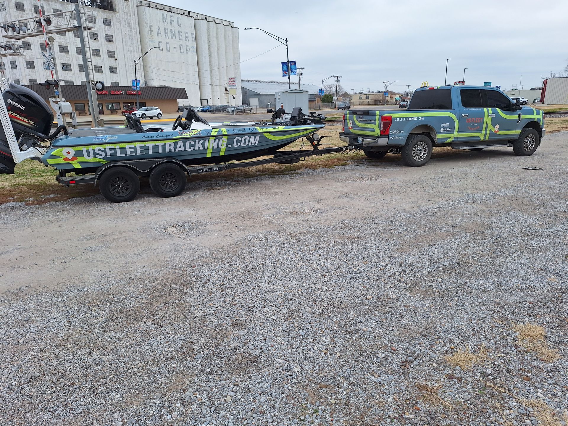 A truck is towing a boat on a trailer.