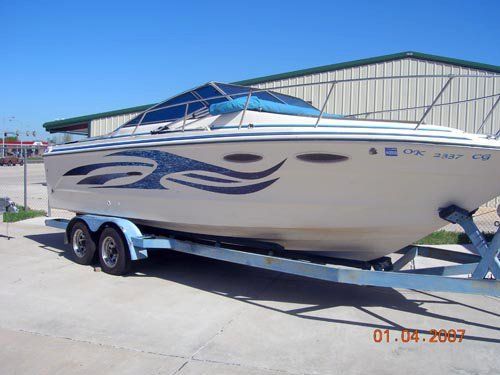 A boat on a trailer with a license plate that says nc