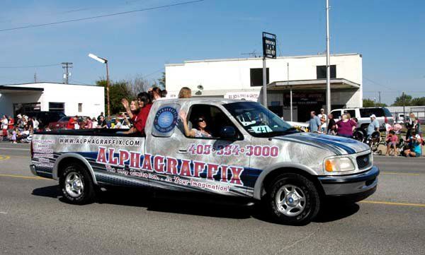 A silver truck with the word alphagrapix on it