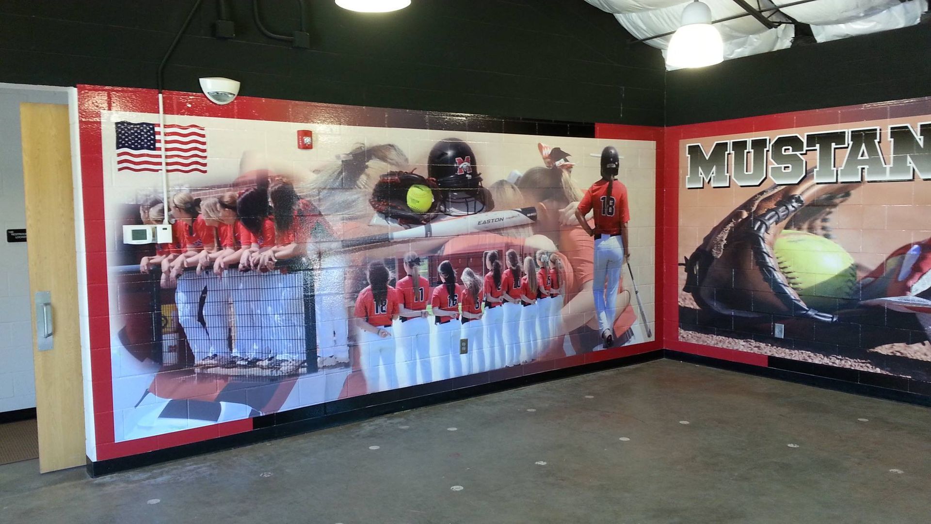 A room with a mural on the wall that says mustang