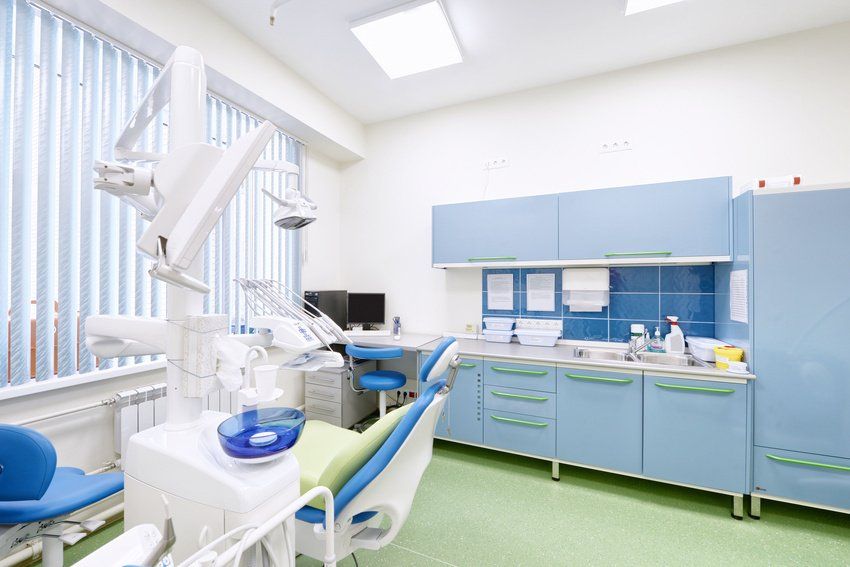 A dental office with a dental chair and dental equipment