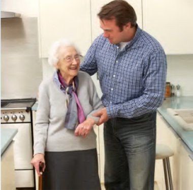 Man assisting an elderly woman