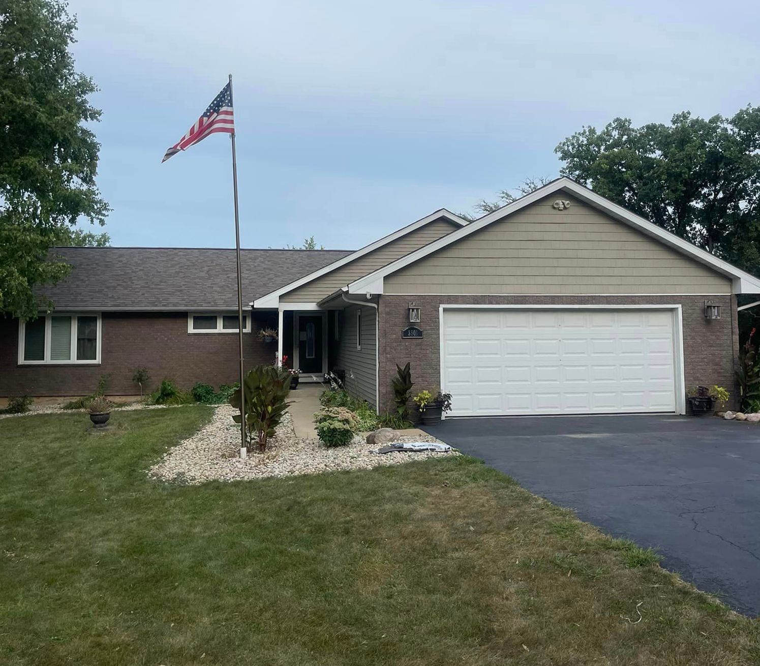 A house with an american flag flying in front of it