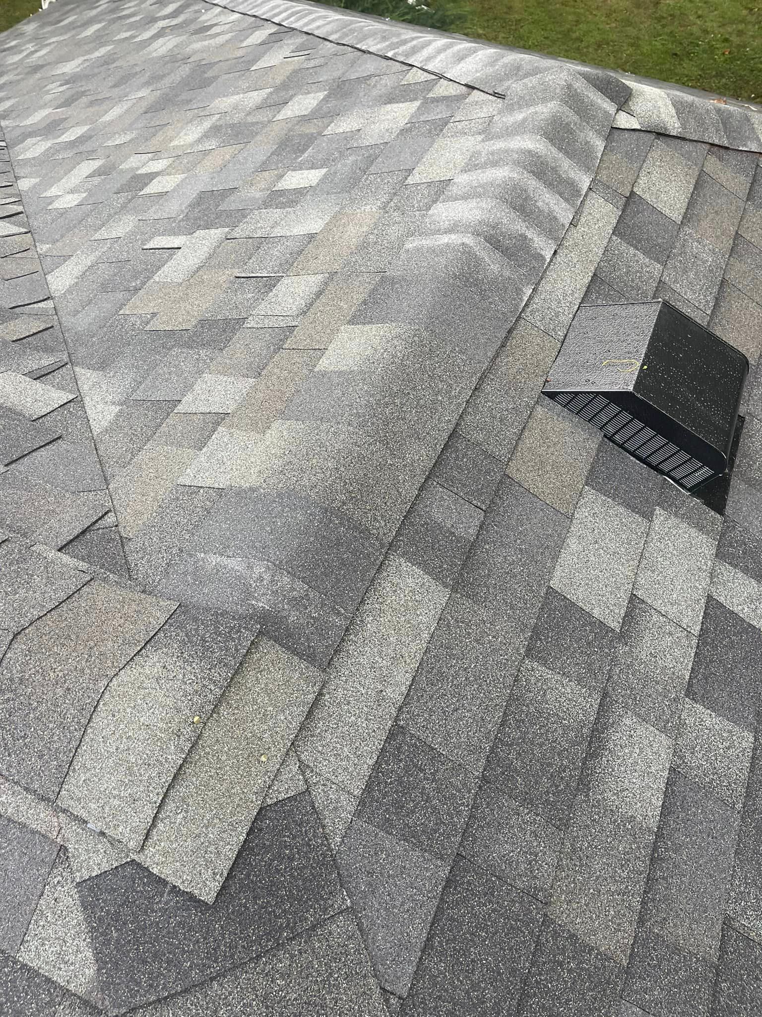 A close up of a roof with a drain on it