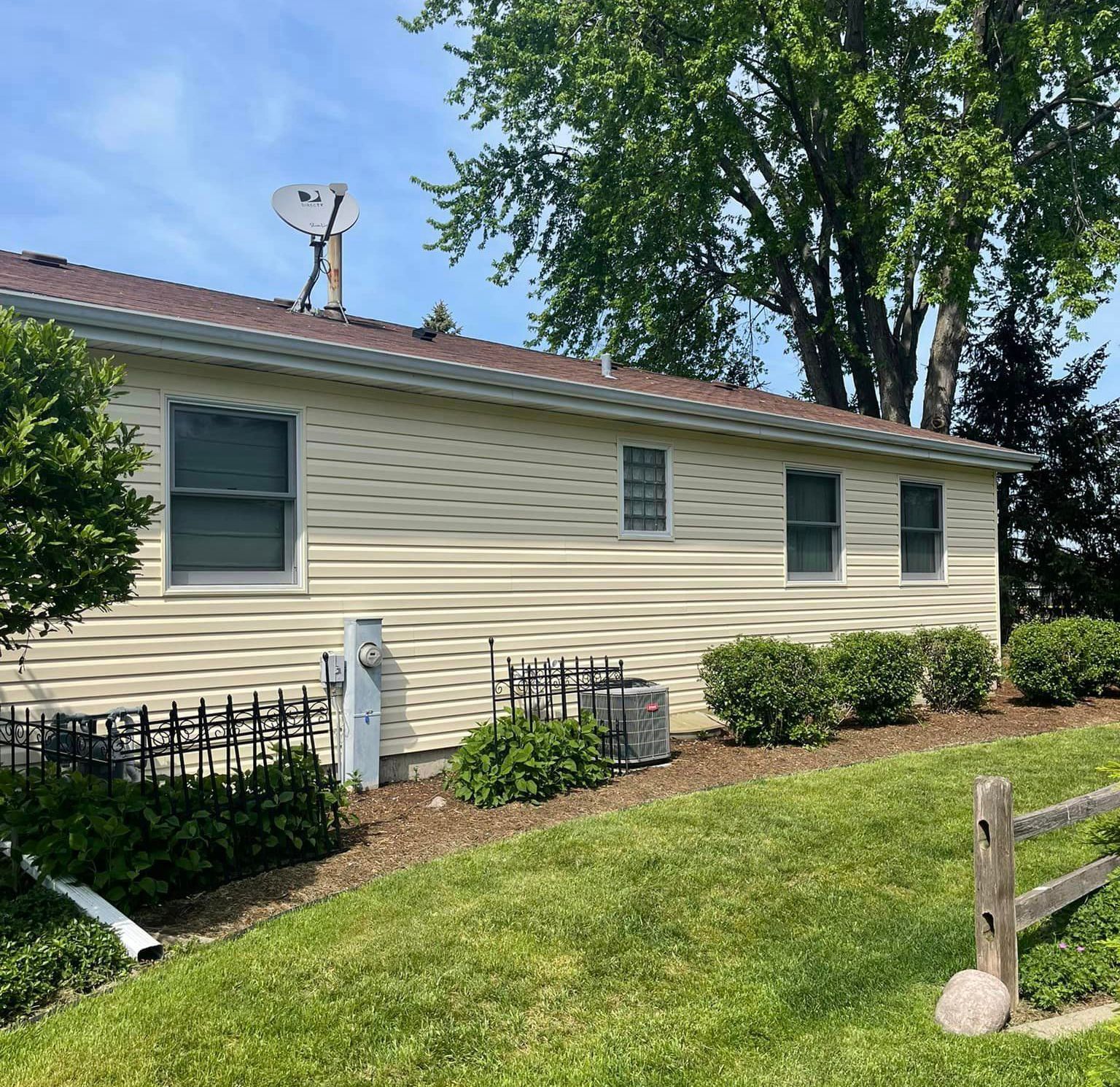 A house with a satellite dish on top of it
