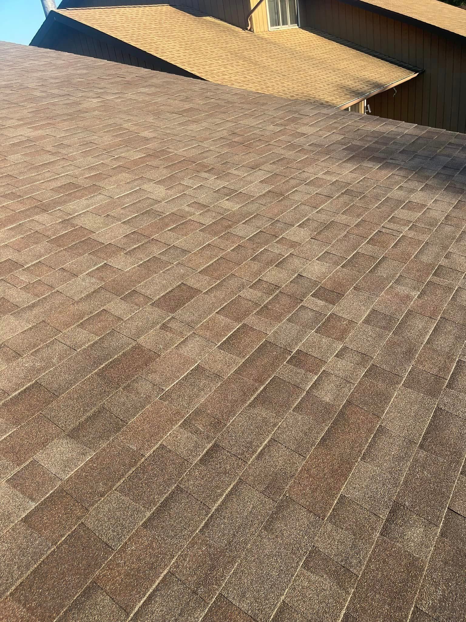 A close up of a roof with a chimney on it