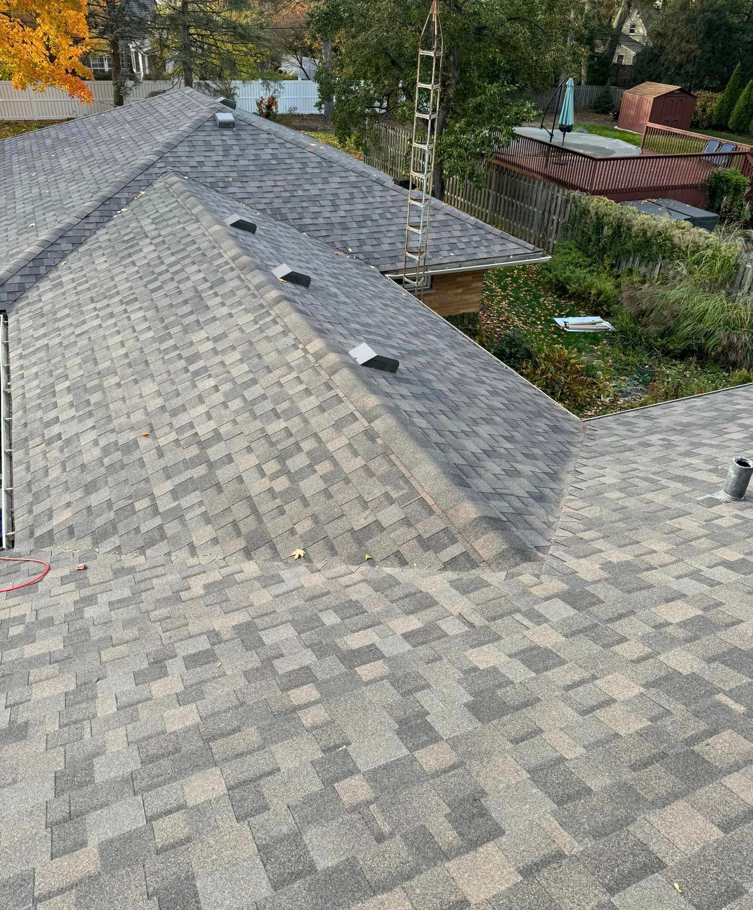 A close up of a roof with shingles on it