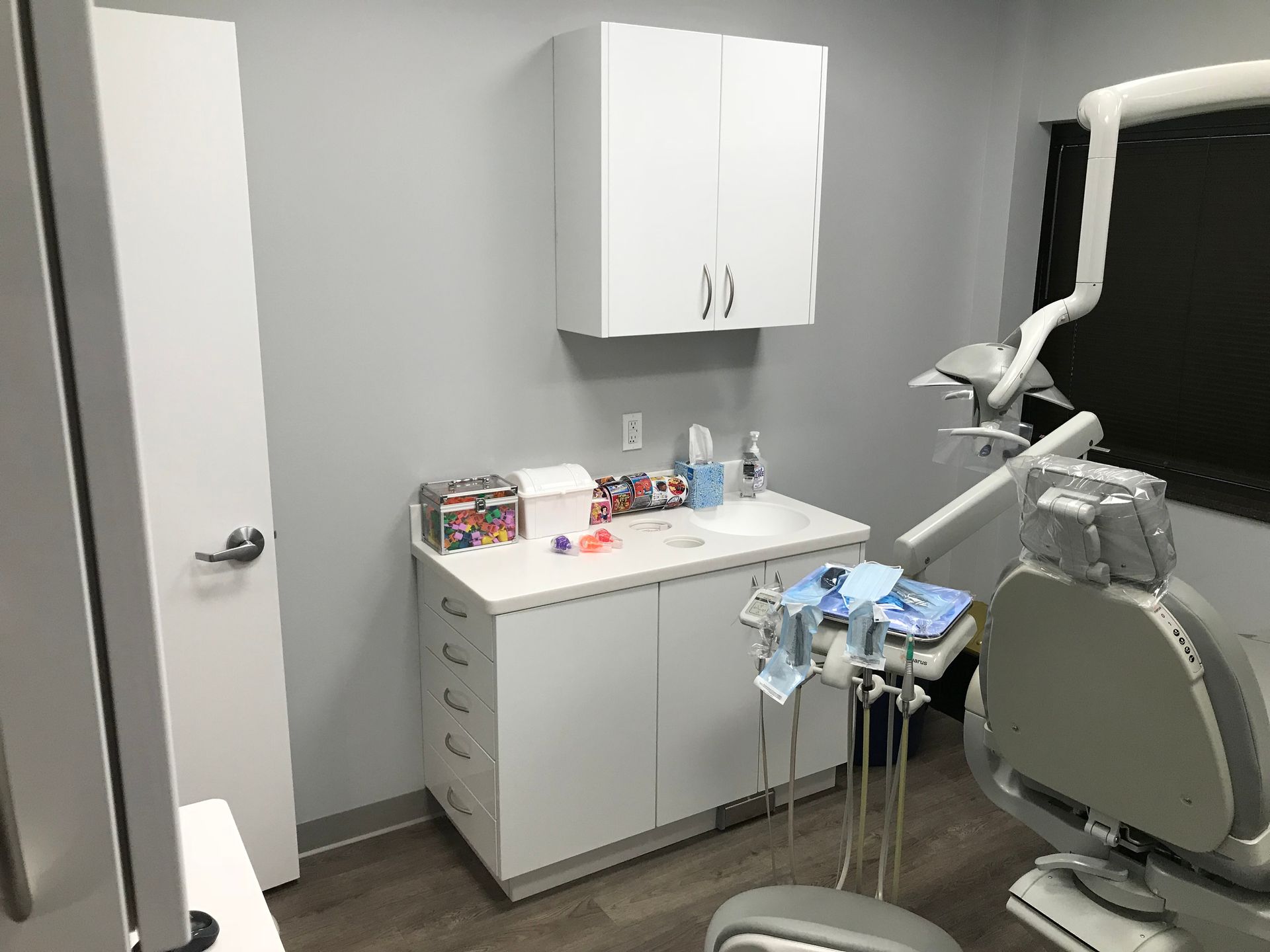 white dental cabinetry with sink in Valley Smiles