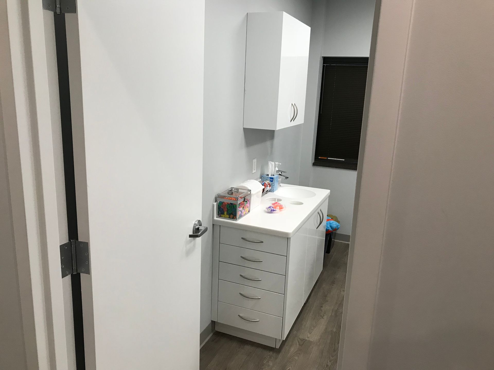 white dental cabinetry with a sink and drawers in Valley Smiles