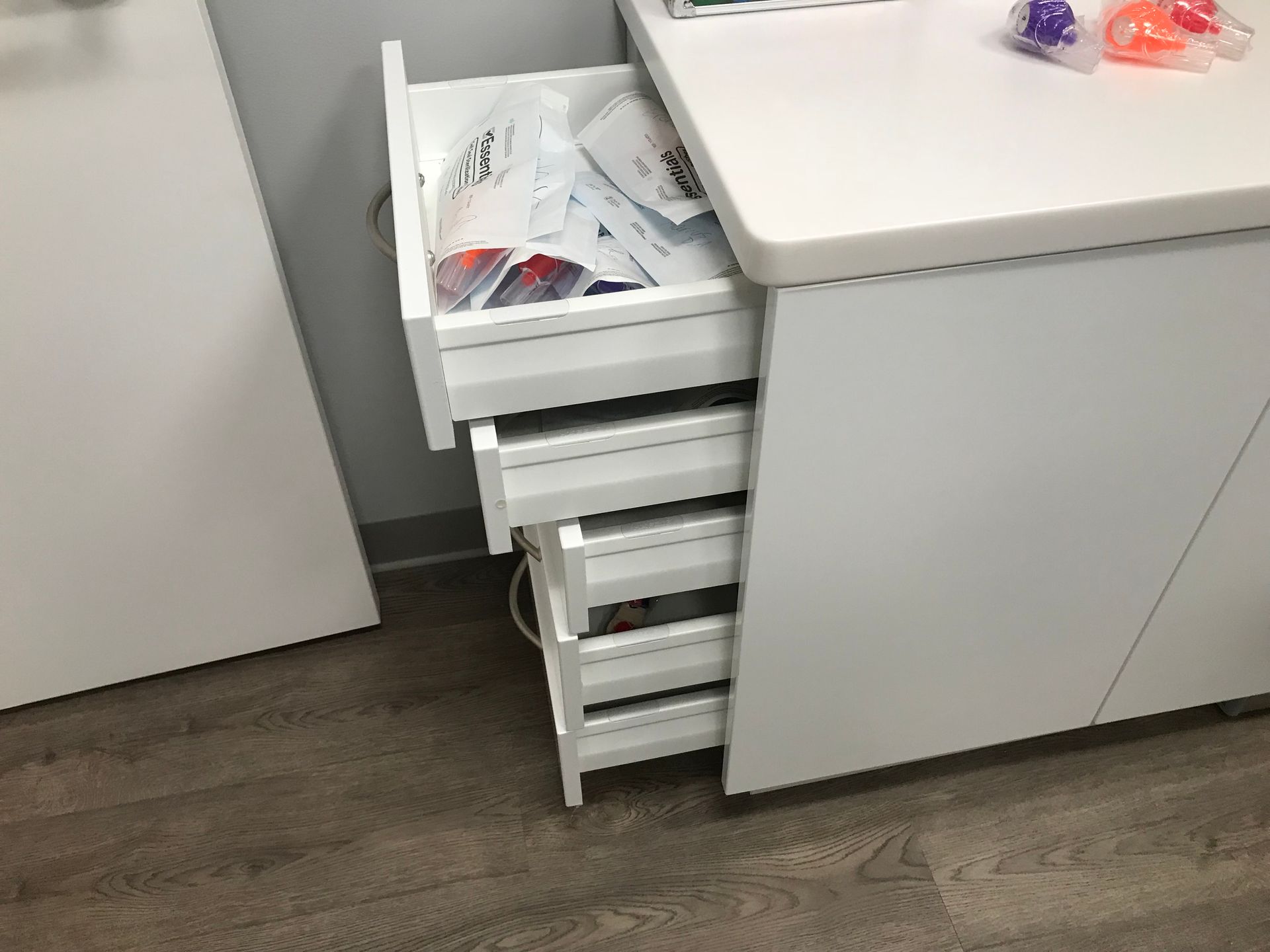 white dental cabinetry with open drawers in Valley Smiles