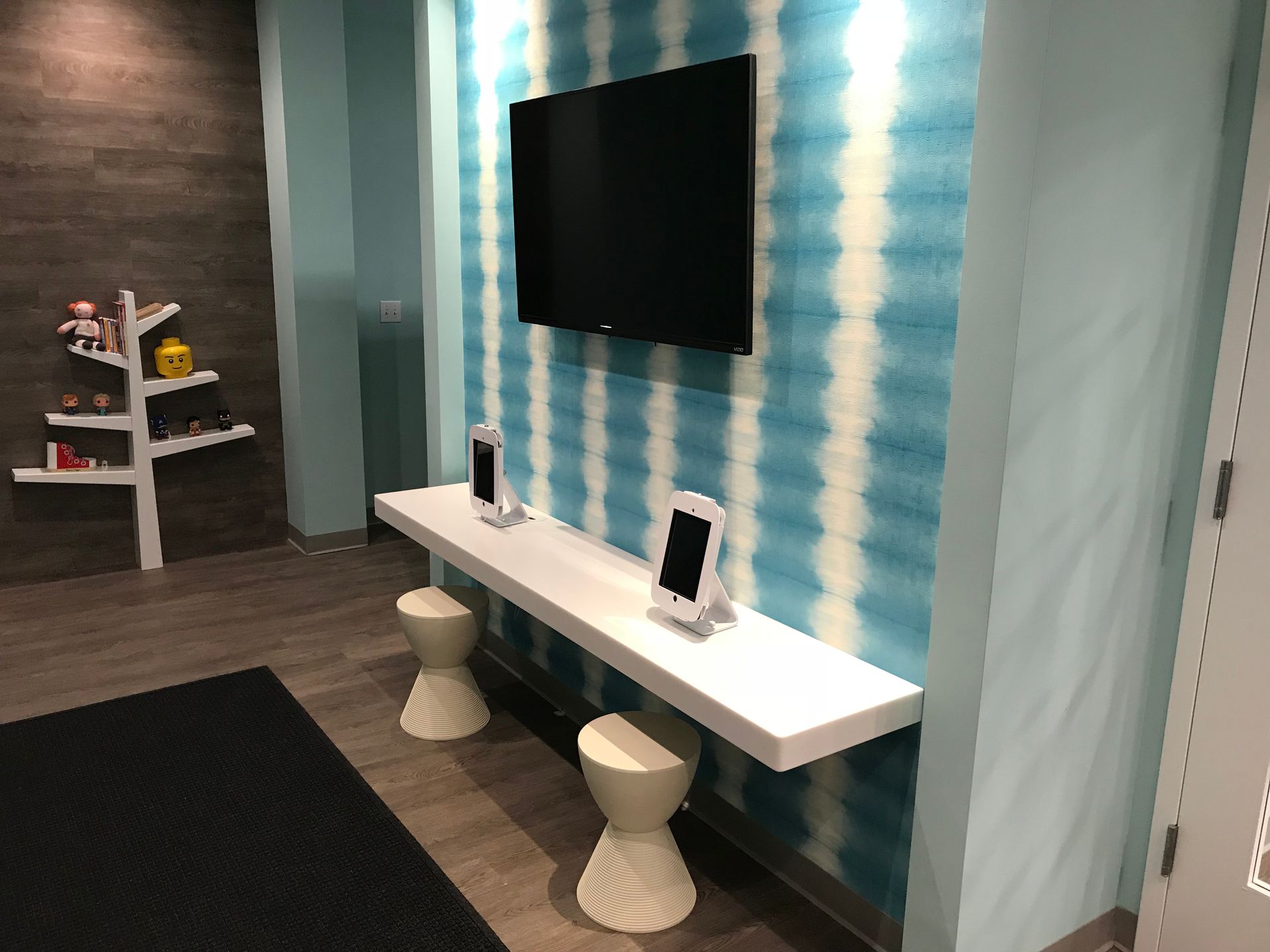 Valley Smiles waiting area with TV and tablet