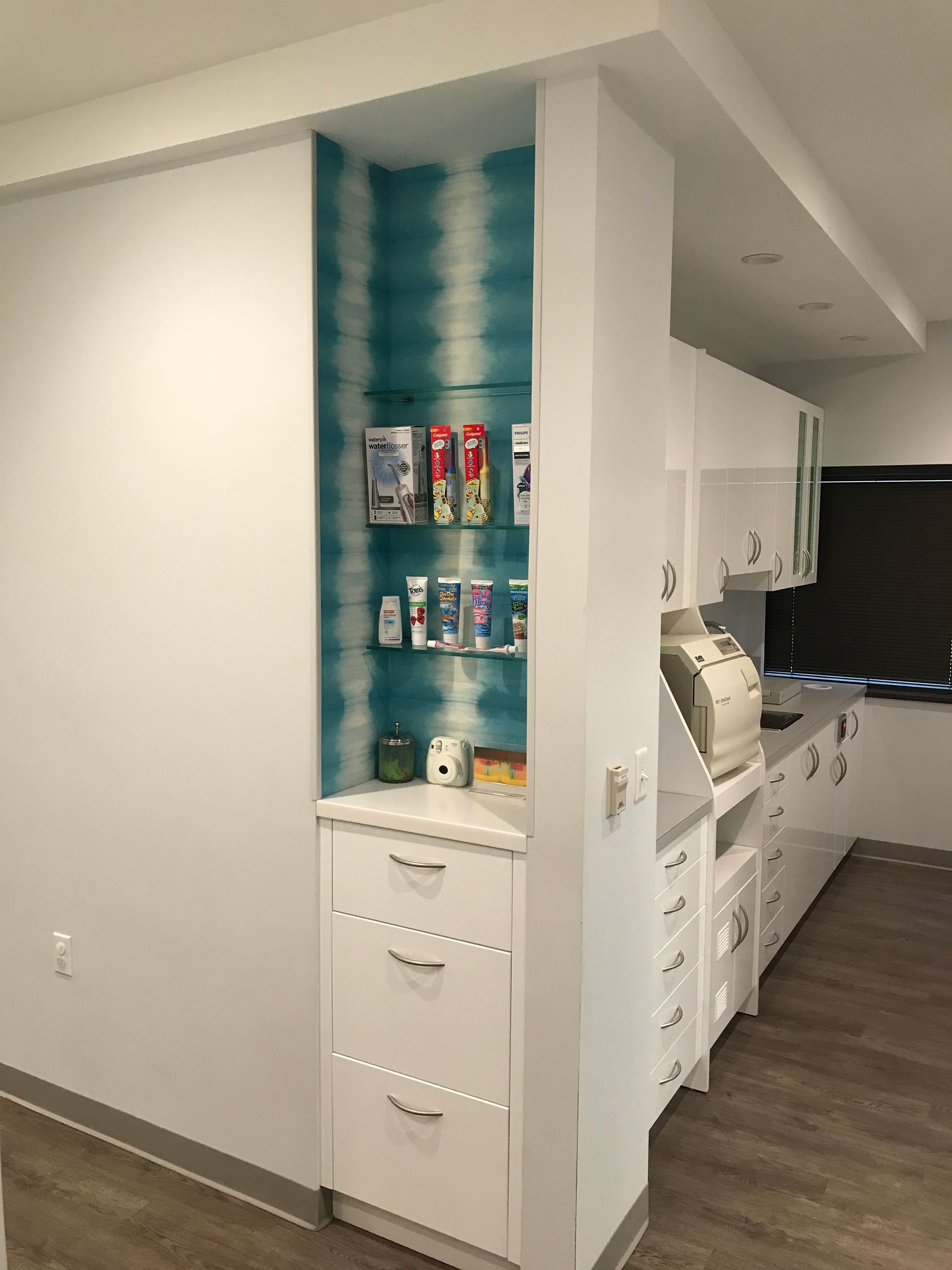 Valley Smiles glass shelves and white cabinetry