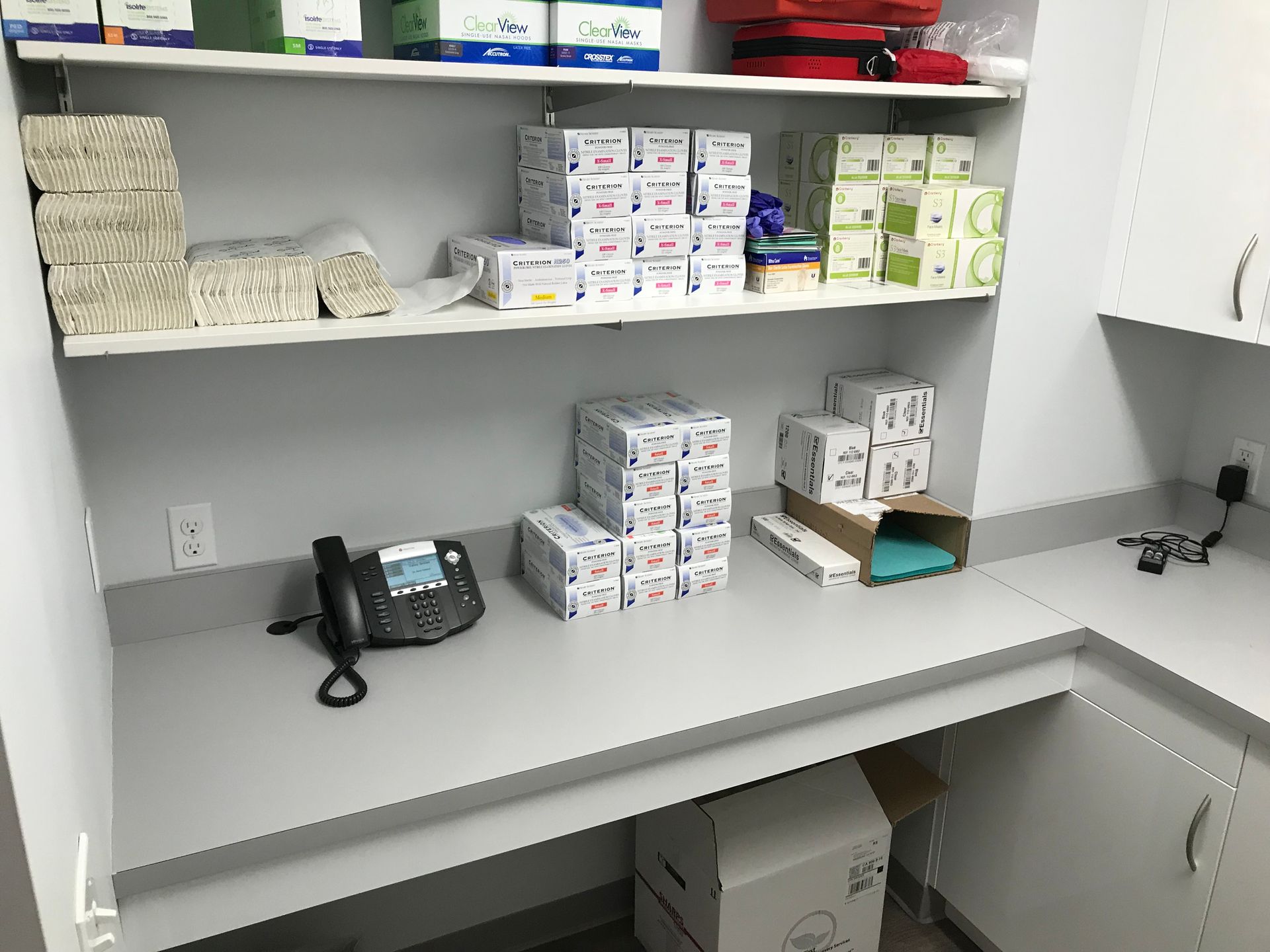 white shelves stocked with supplies in Valley Smiles