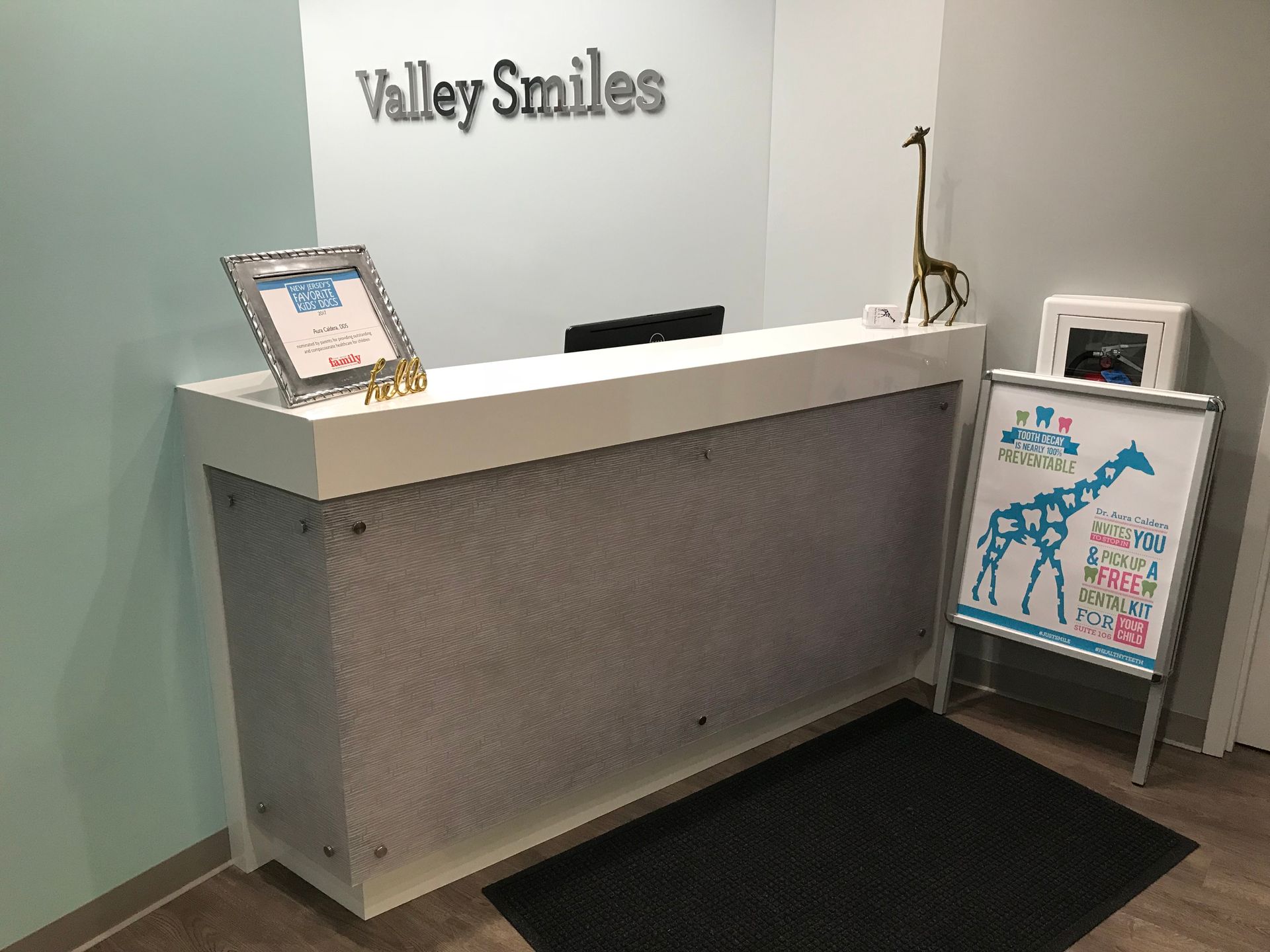 Valley Smiles reception area with a giraffe decor