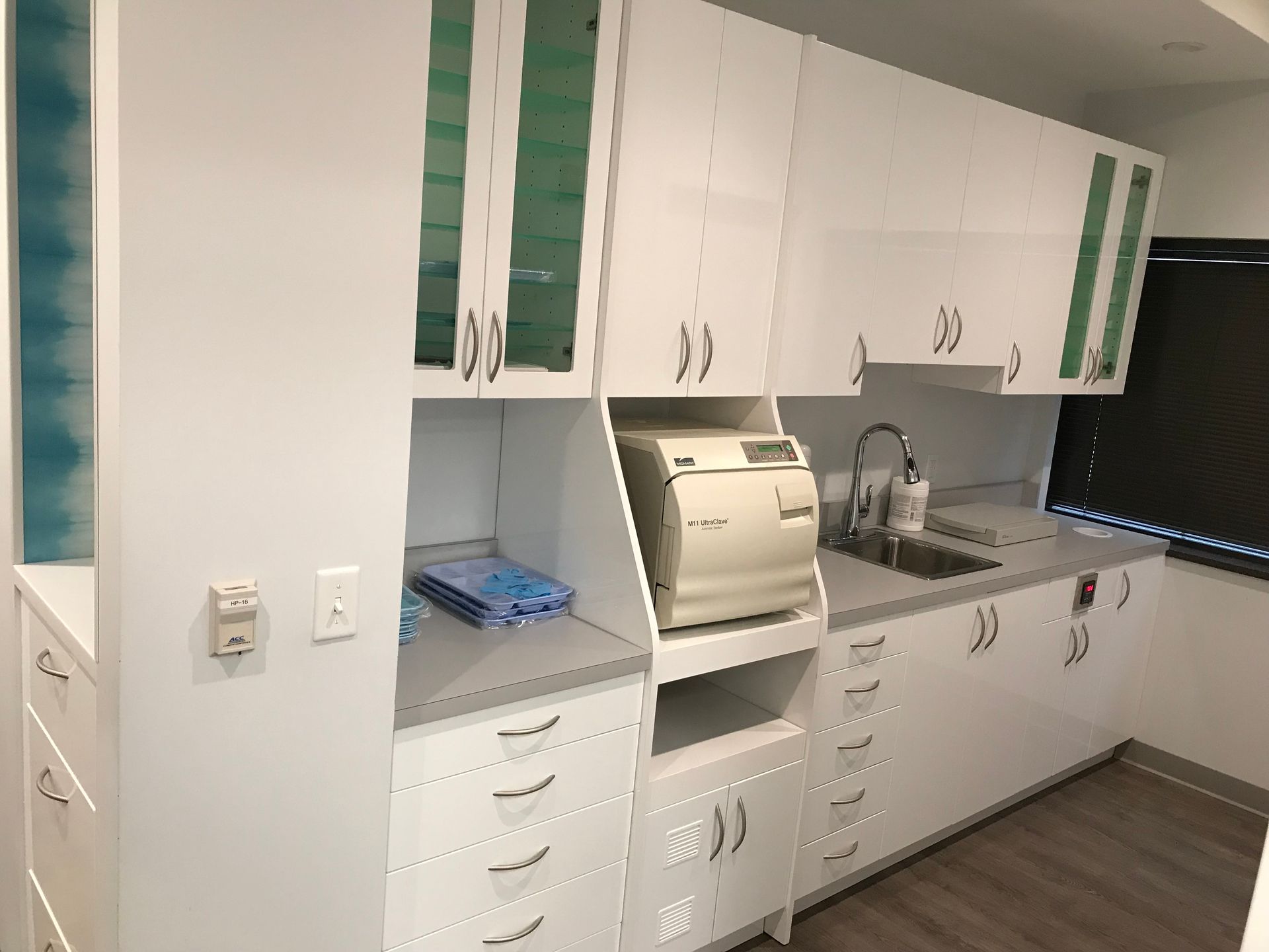 custom white dental cabinetry and gray counters