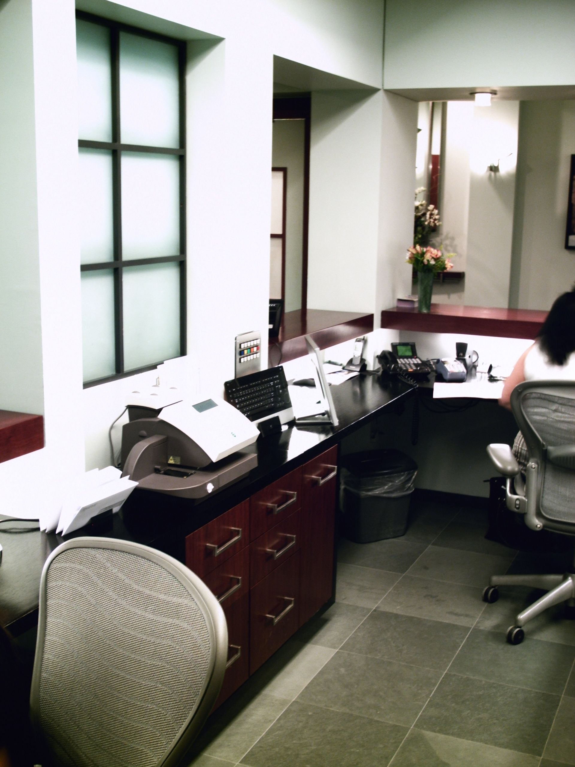 brown desks and cabinets in the reception area