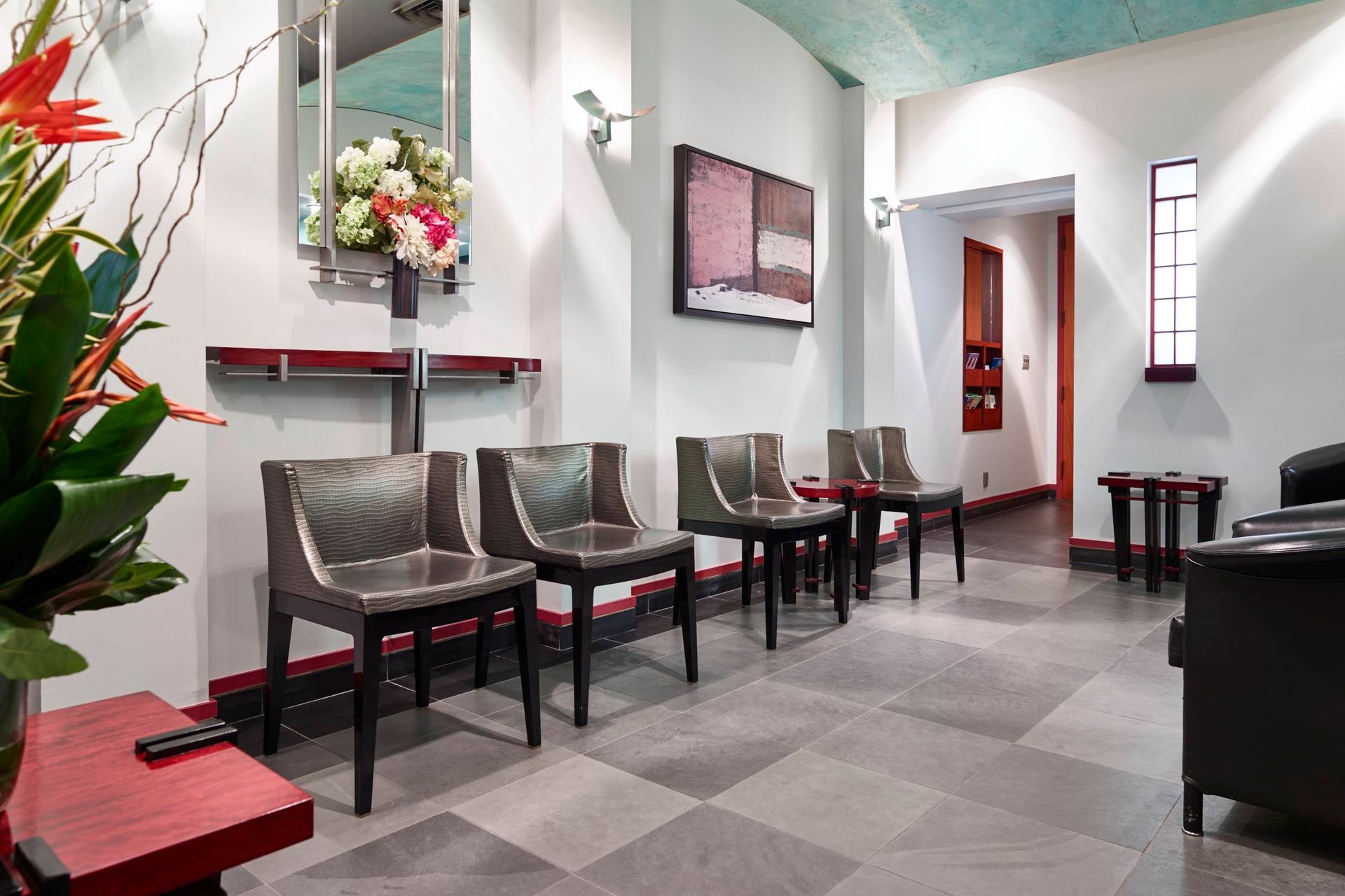 waiting area with chairs and flowers