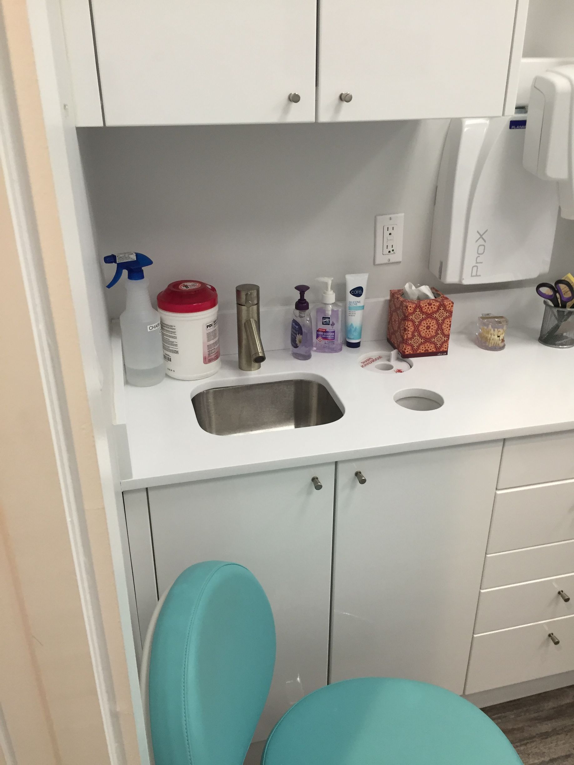 customized dental cabinetry with sink and waste disposal