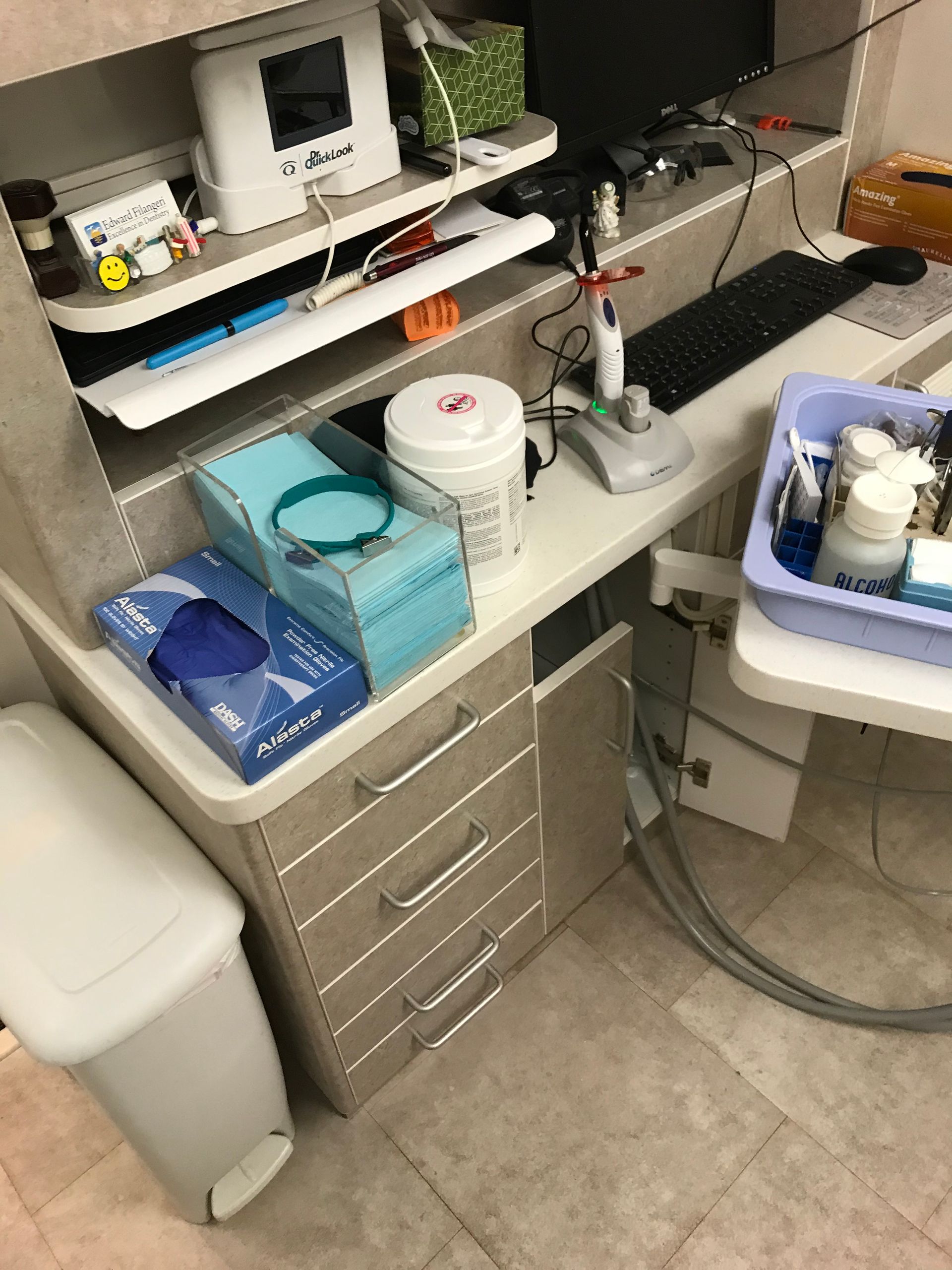 dental cabinet with a lot of supplies on the counter