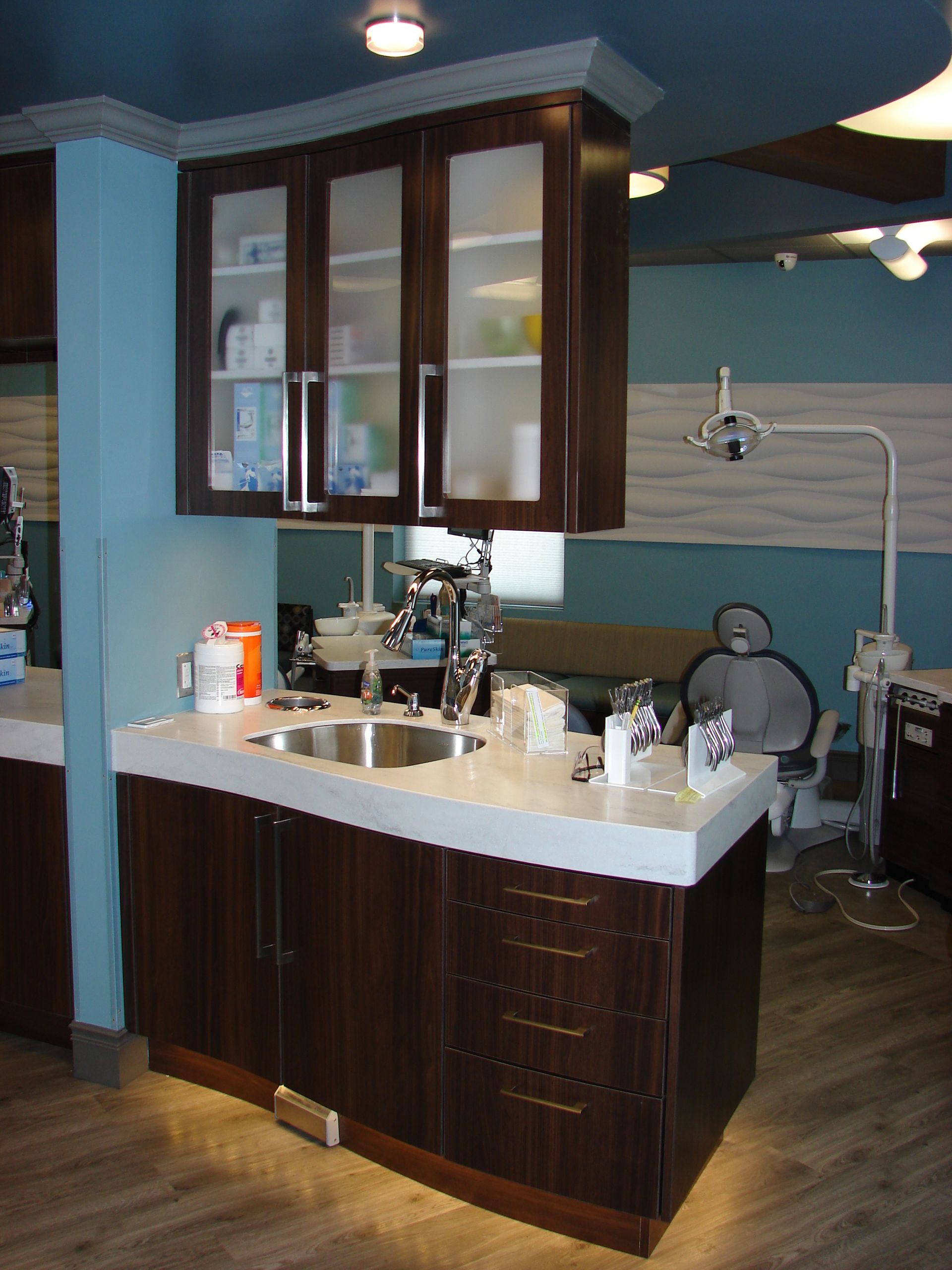 curved dental cabinets with sink and countertop