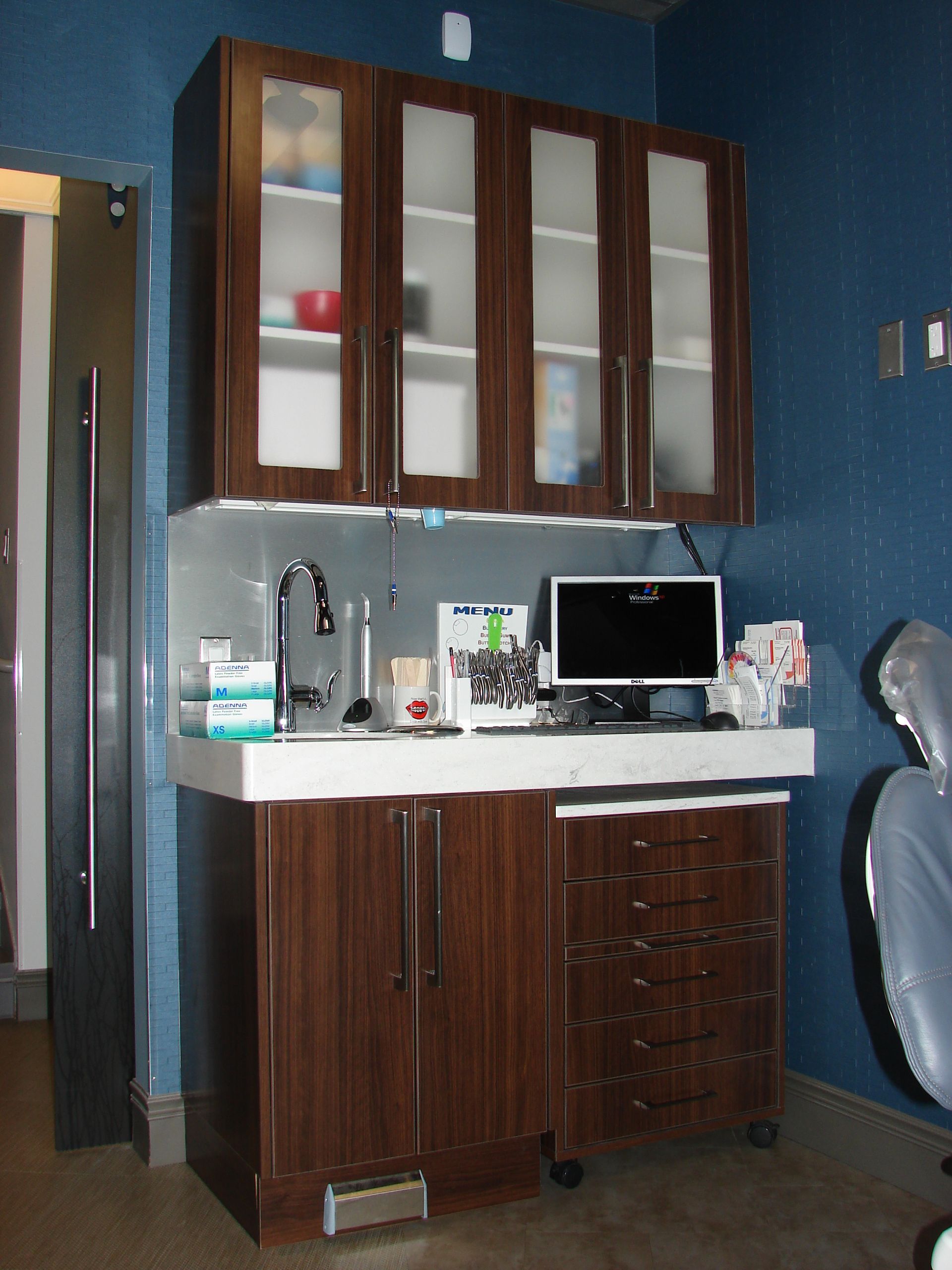 brown cabinets with glazed glass doors