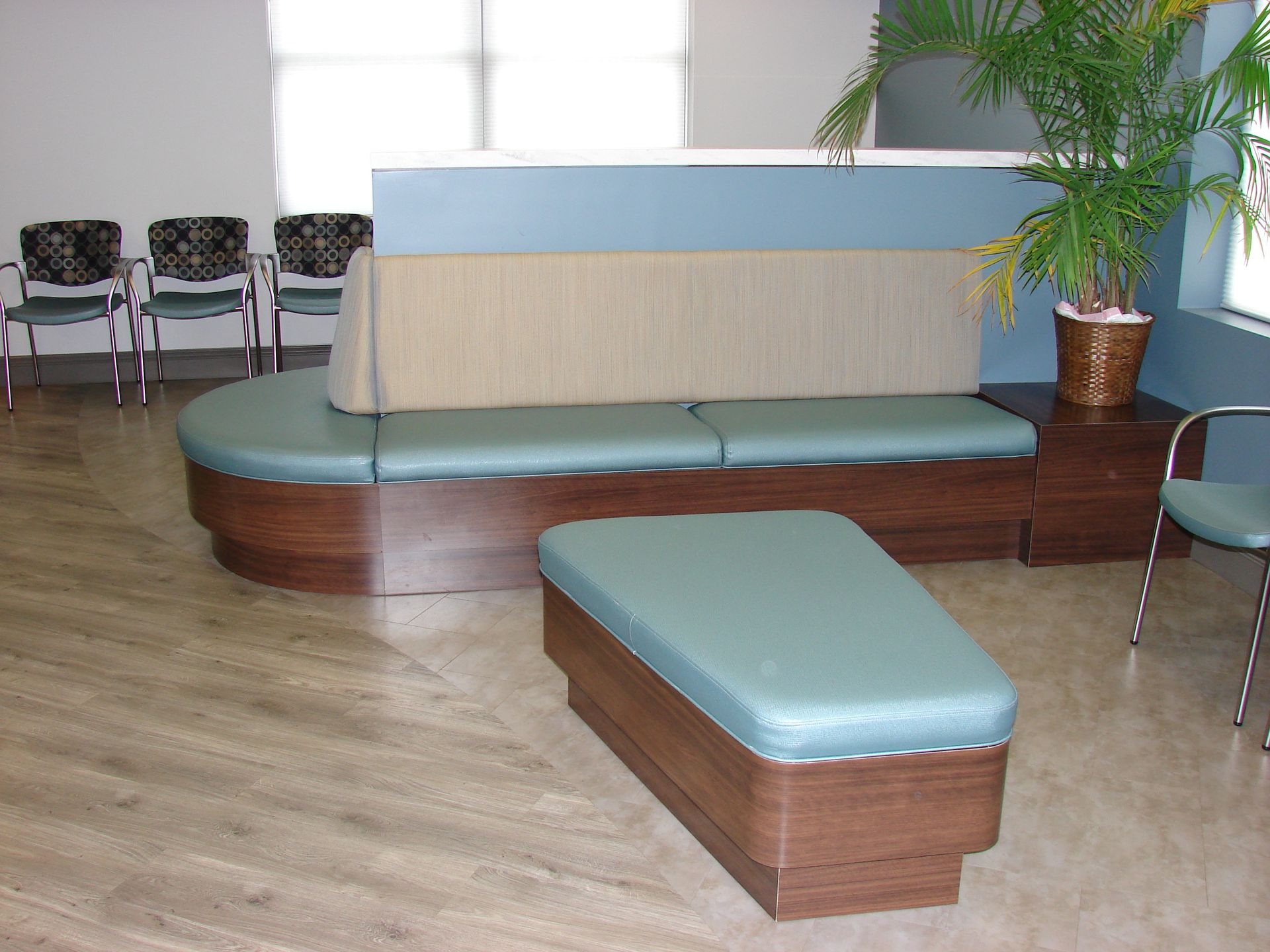 curved bench in the middle of the waiting area