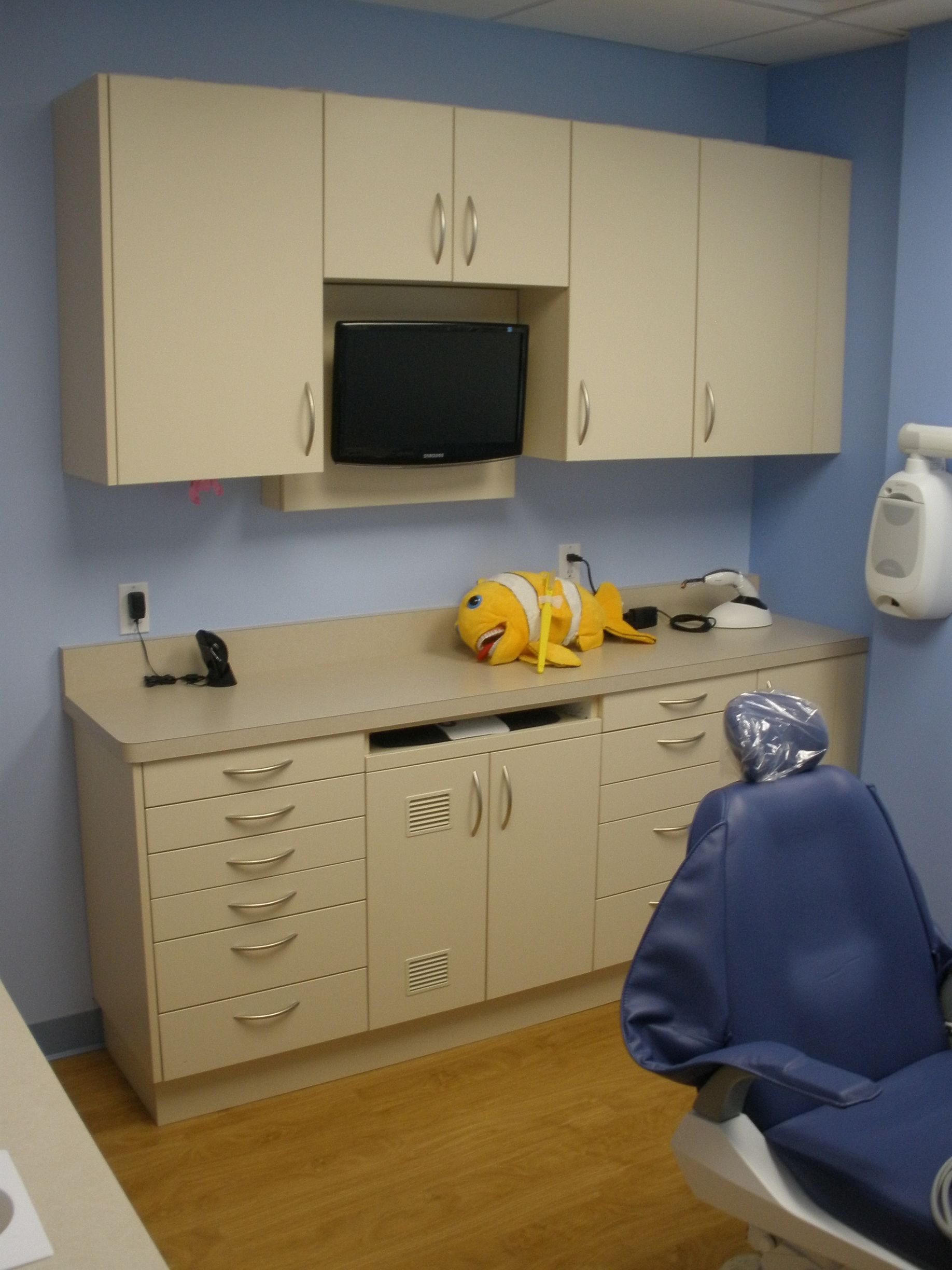 dental cabinet with a stuffed toy on top