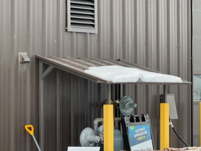 A building with a canopy and a sign