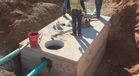 Grease trap being installed