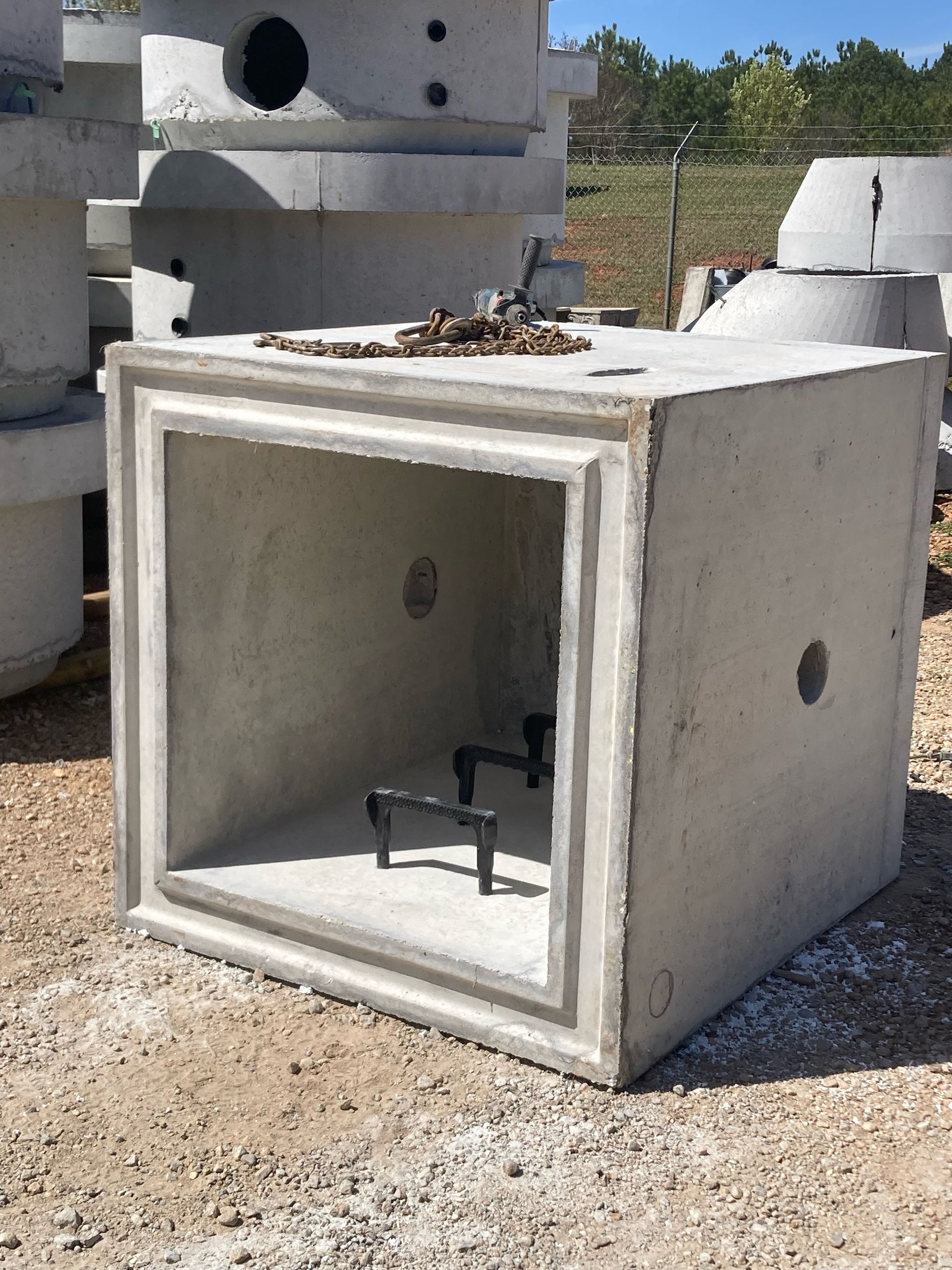 A concrete box with a hole in the middle of it