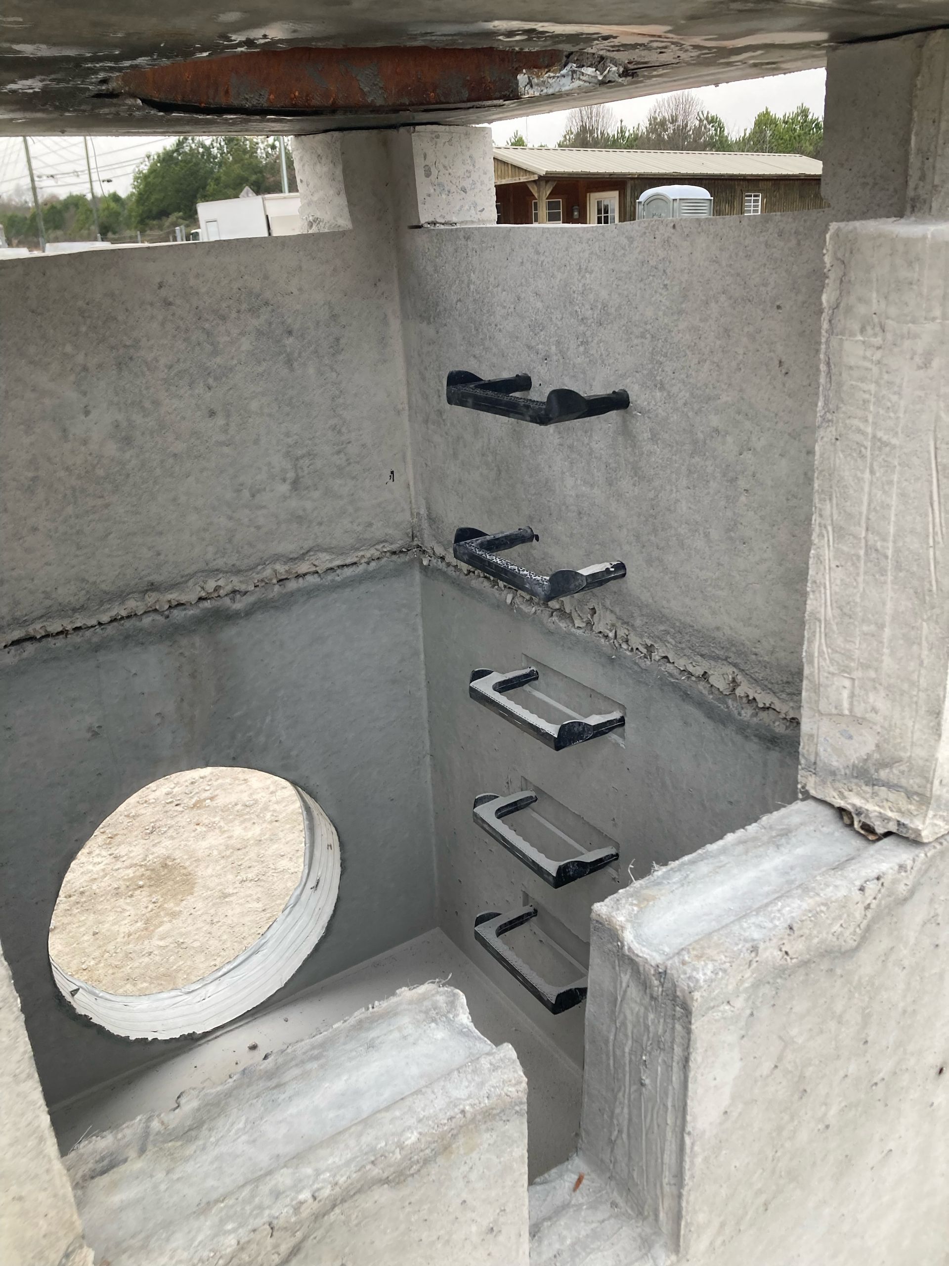 A concrete structure with stairs and a hole in the middle