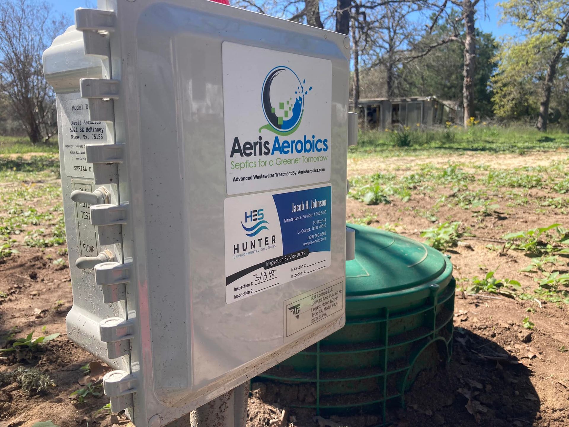 A box with the word aeris aerobics on it is sitting in a field.