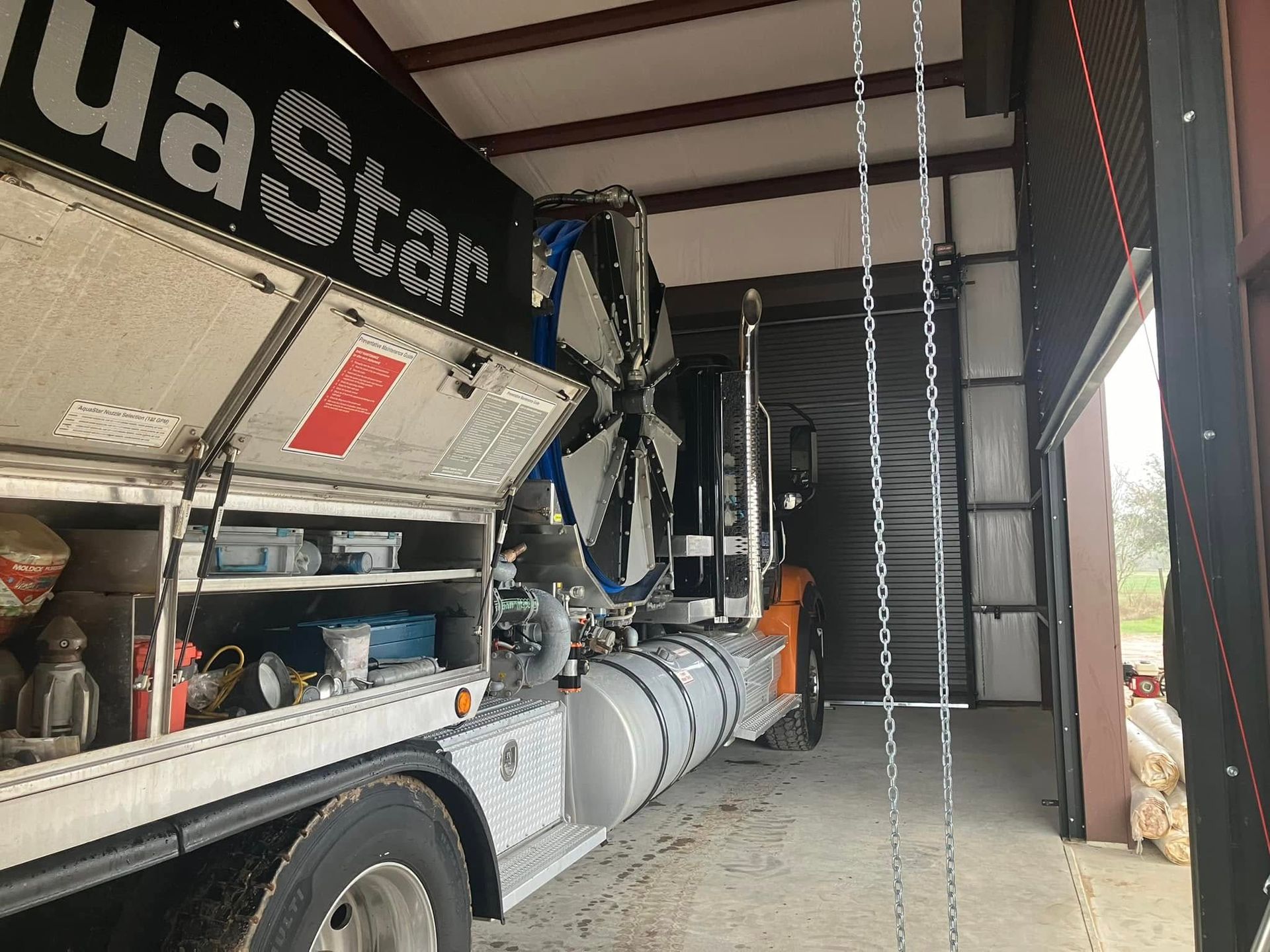A ua star truck is parked in a garage