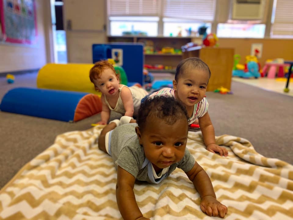 Children laying with paint