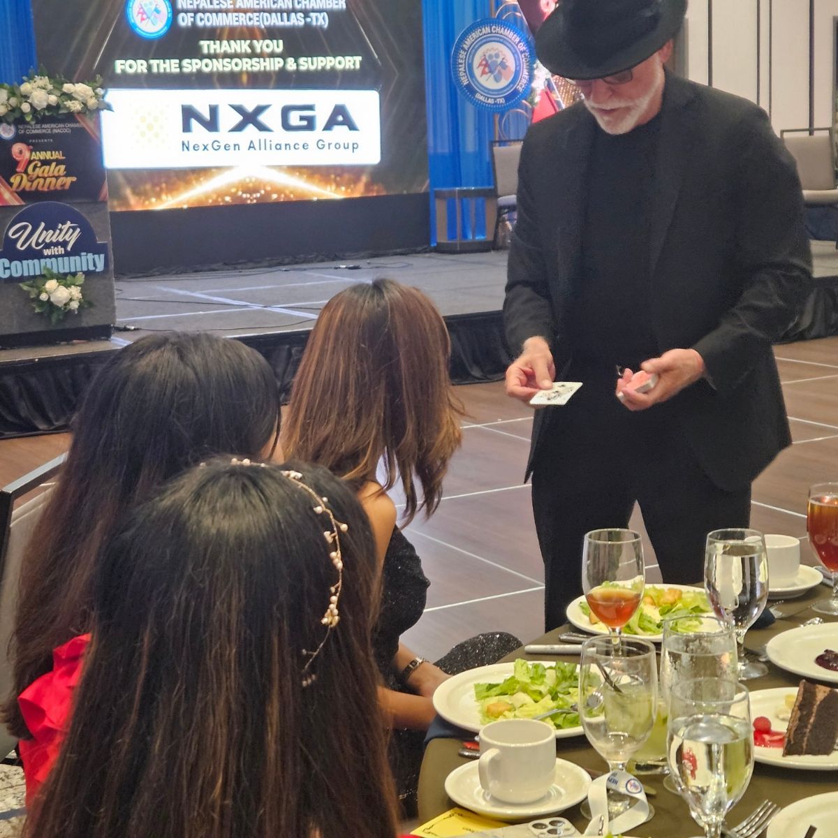 A group of people gather around.