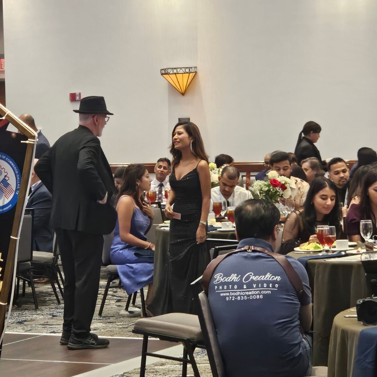 A man wearing a blue shirt that says synthetic creation.