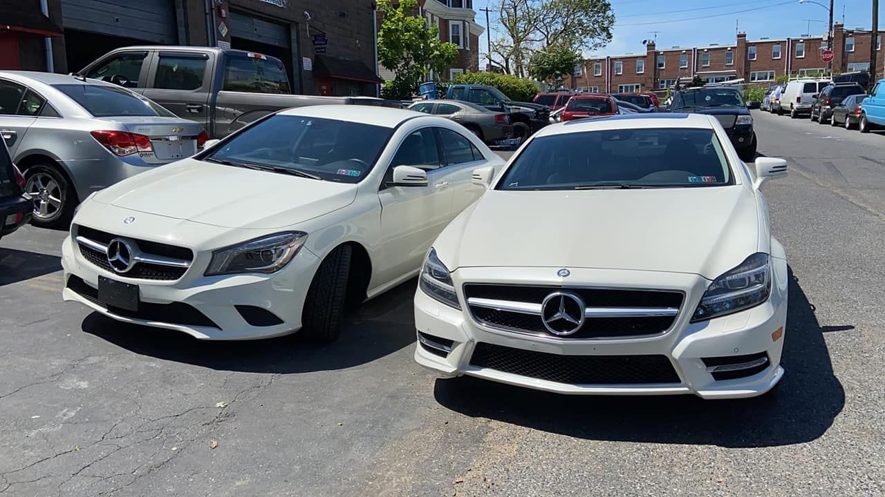Two white cars