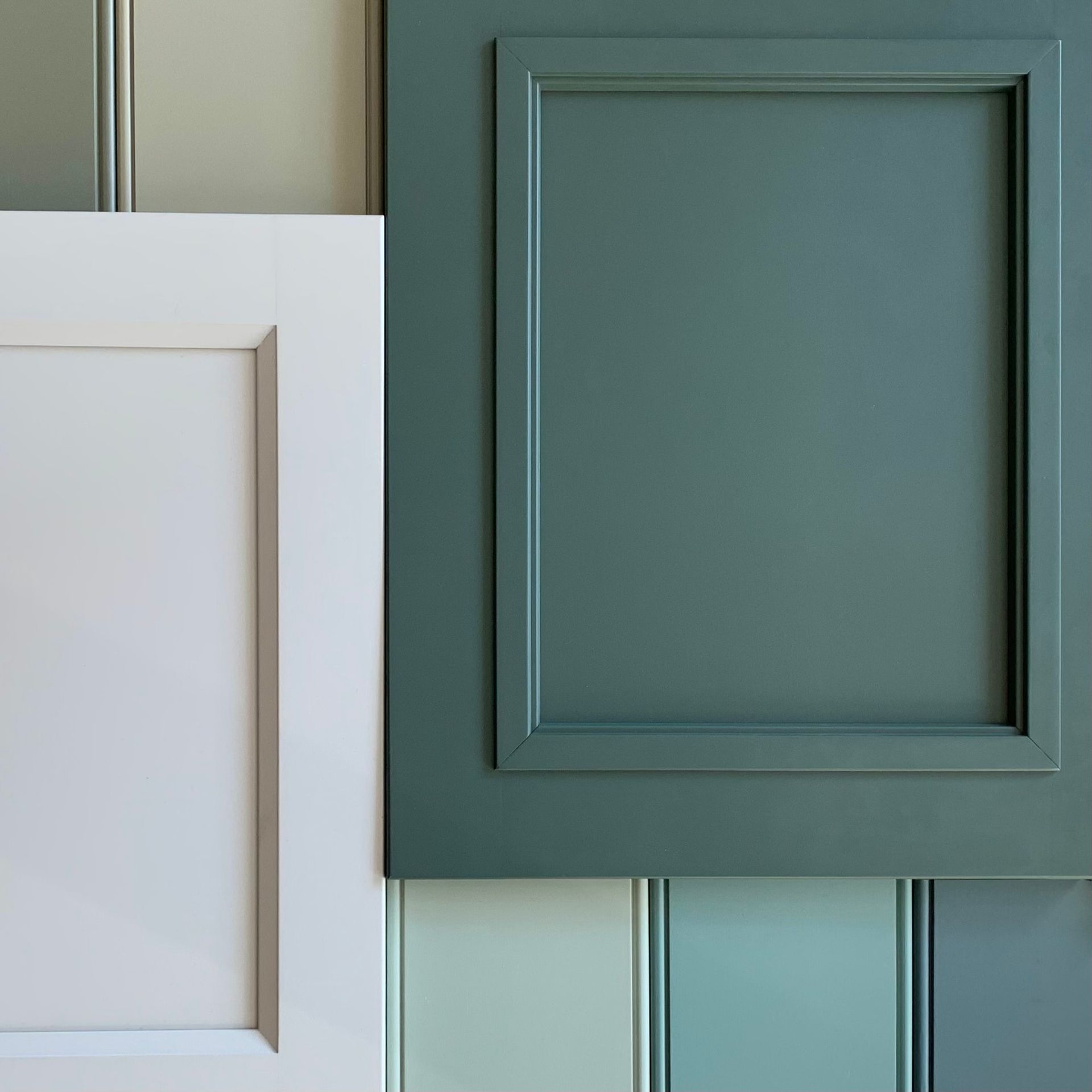White and teal paint samples arranged vertically with a framed teal panel and white panel.