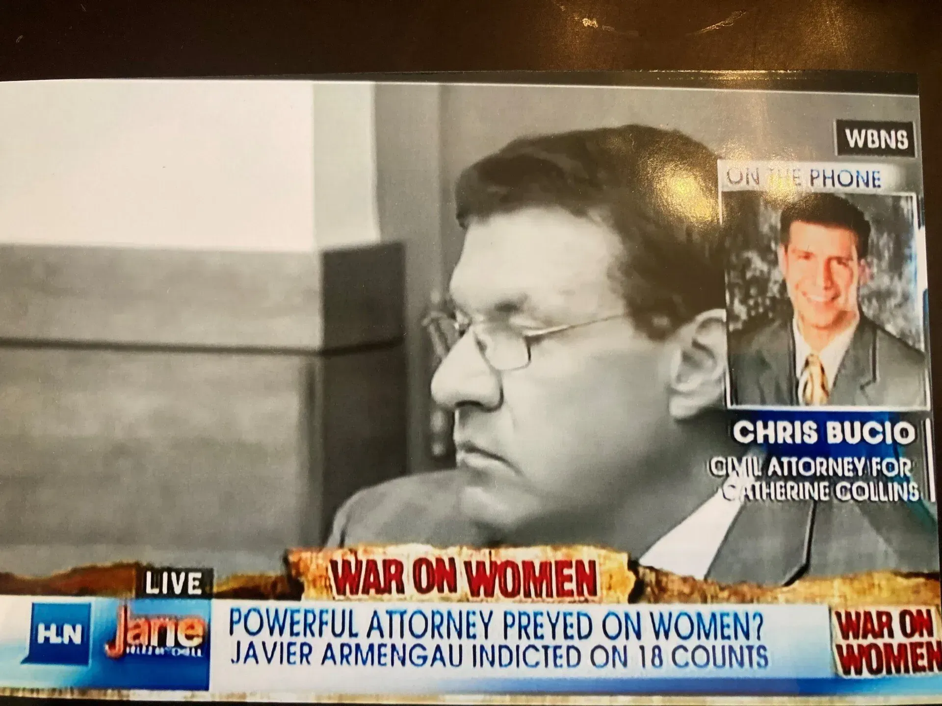 HLN news screen showing attorney Javier Armengau with an inset of attorney Chris Bucio, discussing an 18-count indictment.