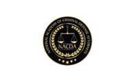 Black and gold emblem for the National Academy of Criminal Defense Attorneys featuring a scale of justice in the center.