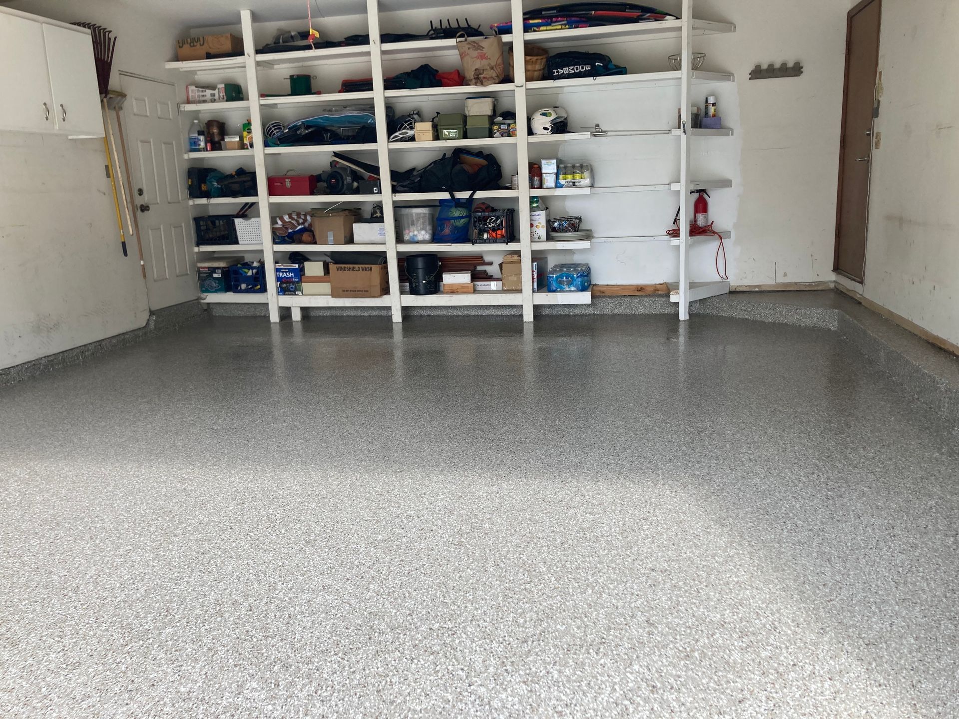 a garage filled with lots of shelves and boxes
