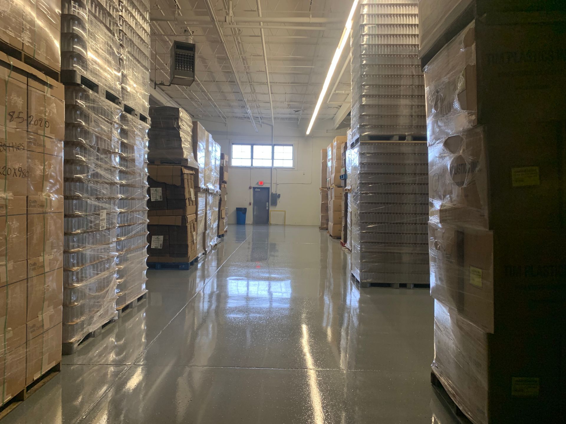 a warehouse filled with lots of boxes and pallets