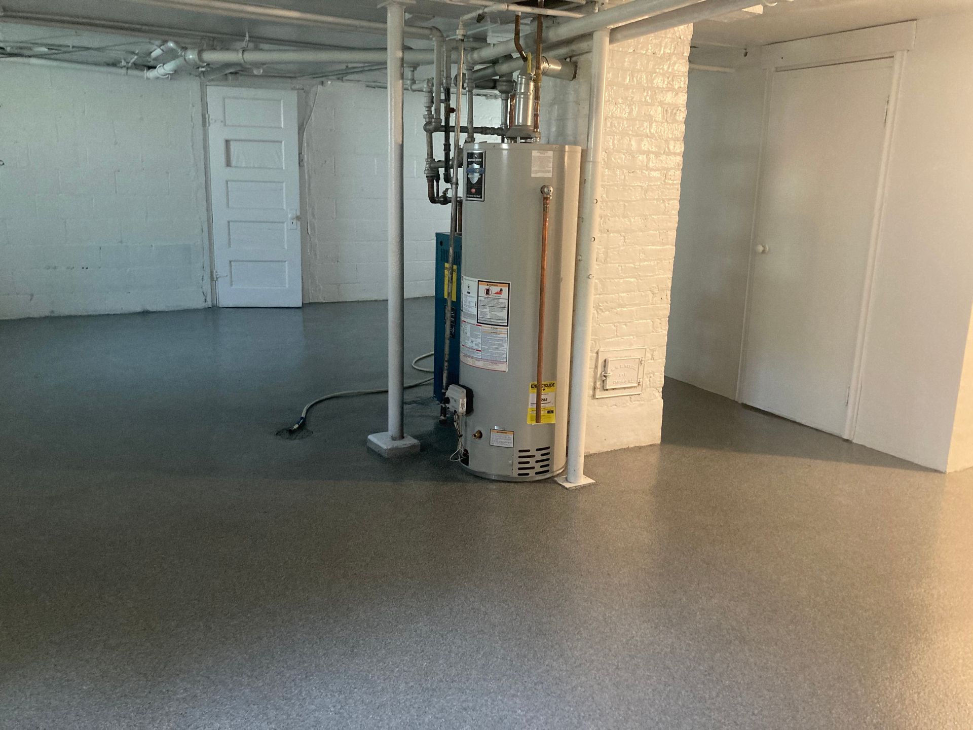 there is a water heater in the middle of the room