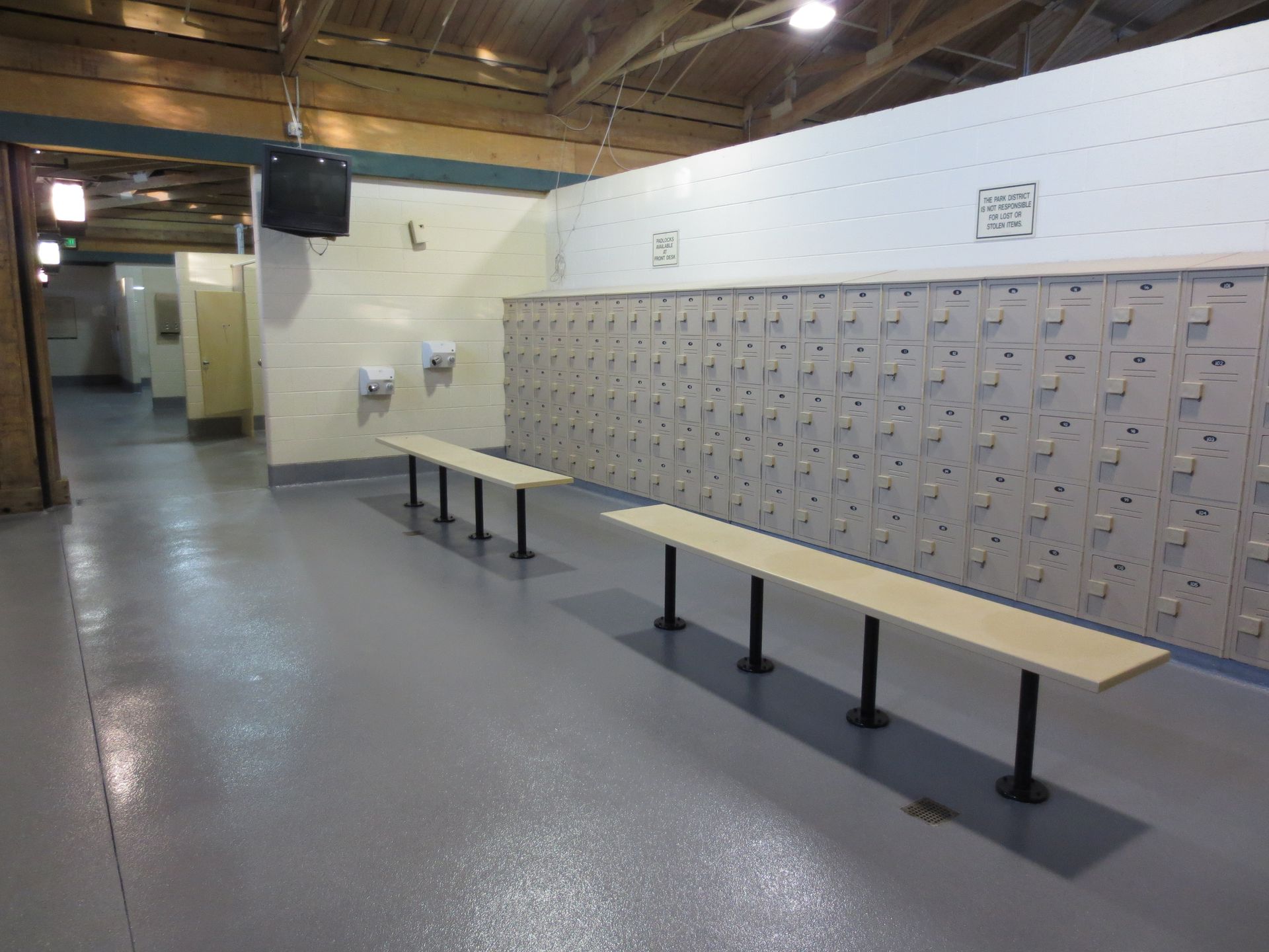 a locker room with lots of lockers and benches