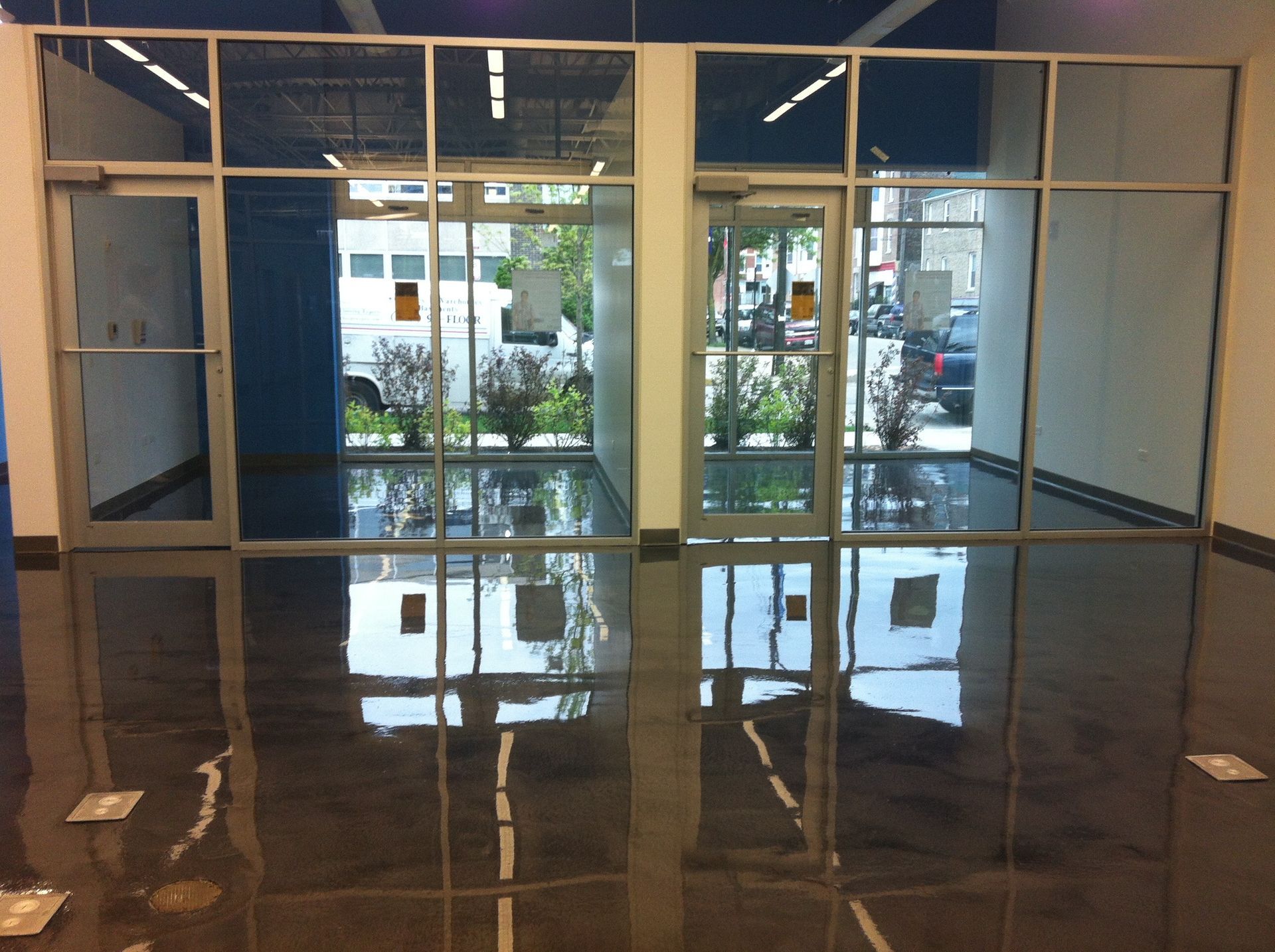 a room with a reflection of a building in the floor